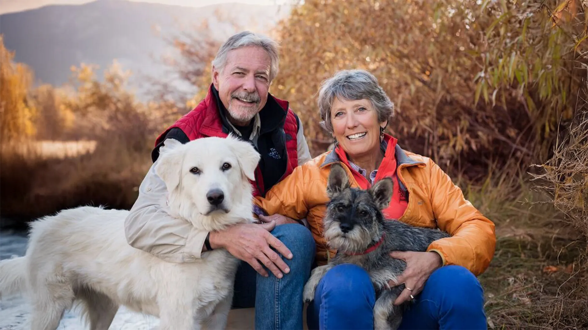 image An Access Mammoth instructor with athlete road biking down a highway smiling at the camera