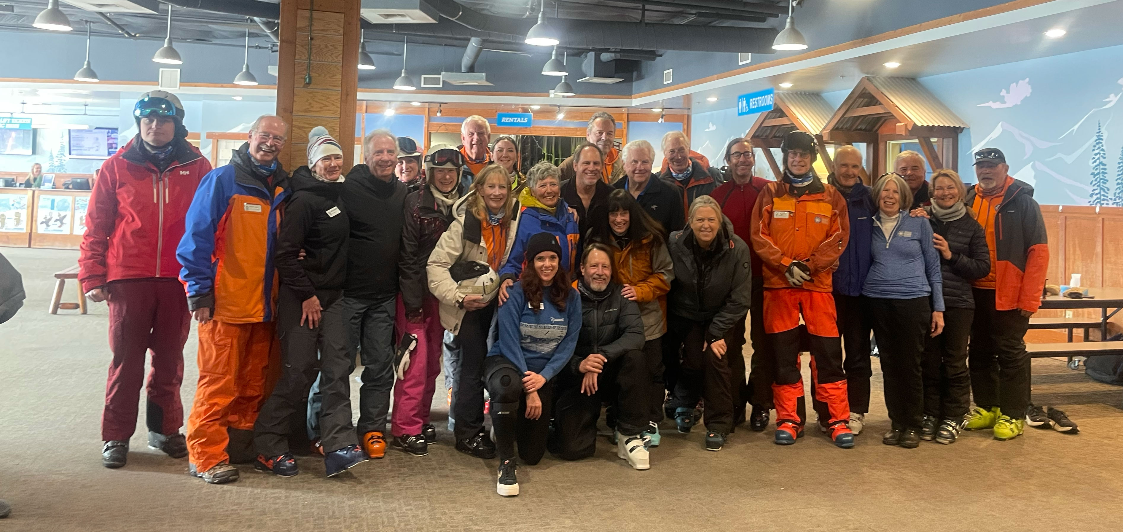 image An Access Mammoth instructor with athlete road biking down a highway smiling at the camera