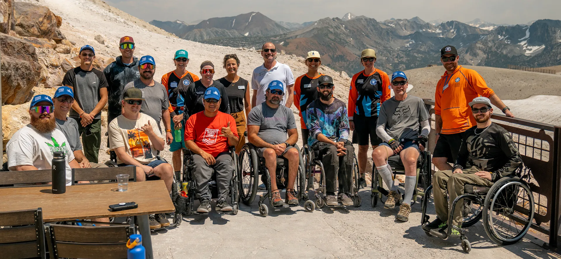 Access Mammoth group photo of adaptive mountain bikers with a scenic view of the Sierra Nevada mountains