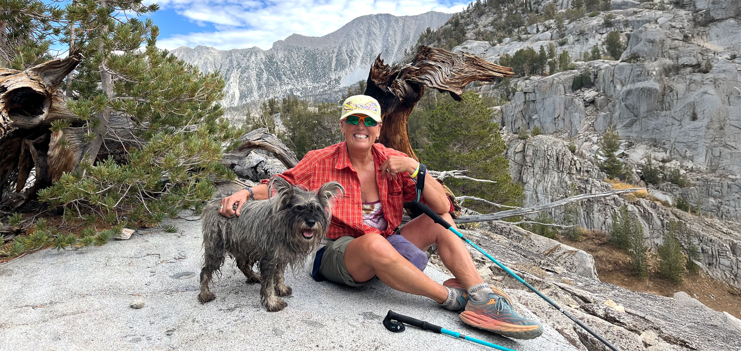 image An Access Mammoth instructor with athlete road biking down a highway smiling at the camera
