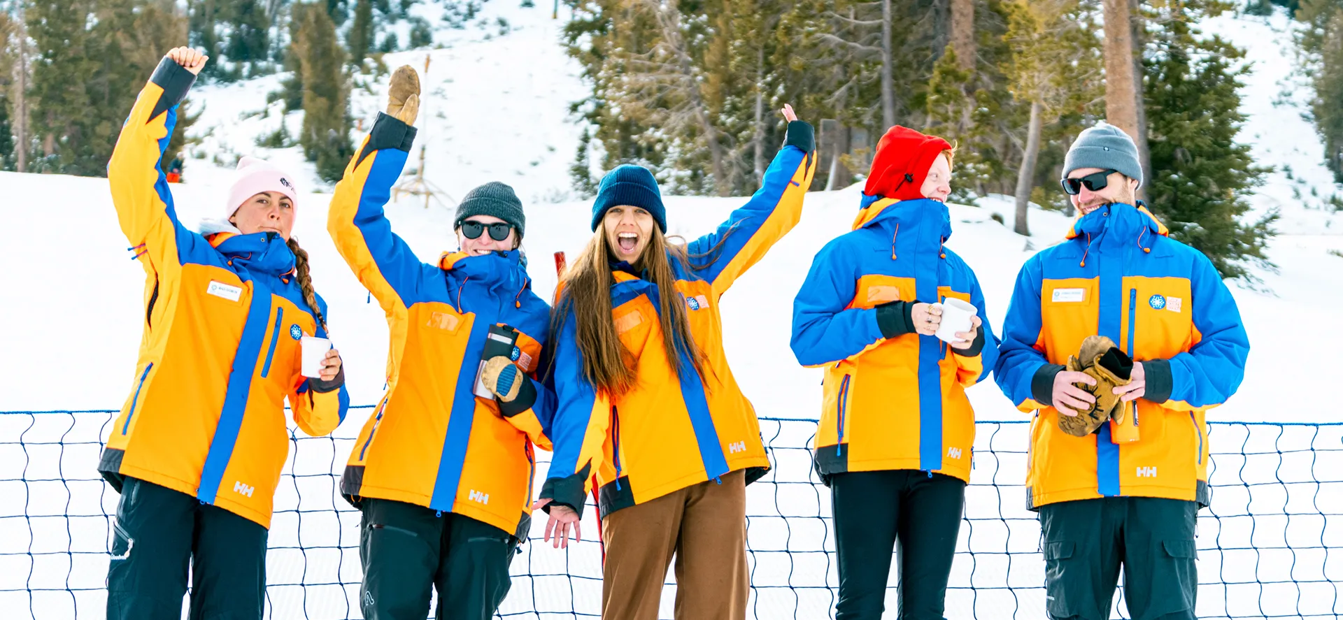 image An Access Mammoth instructor with athlete road biking down a highway smiling at the camera